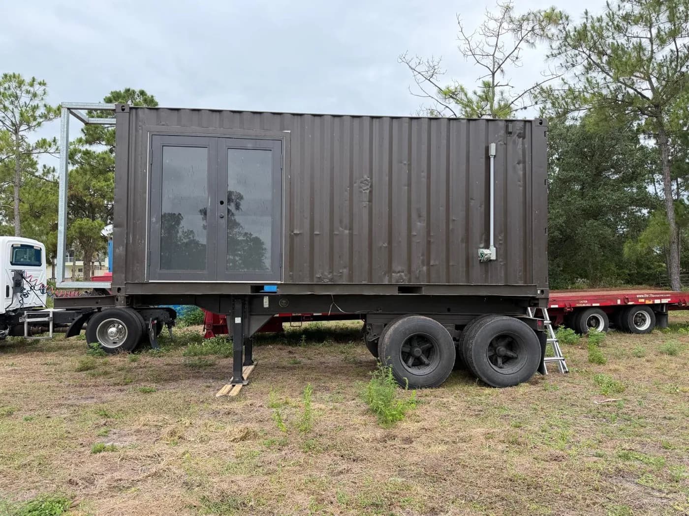 Built 20-foot mobile container mounted on a tandem-axle trailer